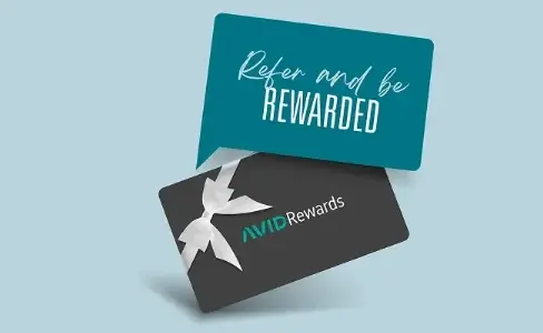 Two cards overlapping on a light blue background. The top card says "Refer and be REWARDED" and the bottom card, with a white ribbon, says "AVID Rewards.